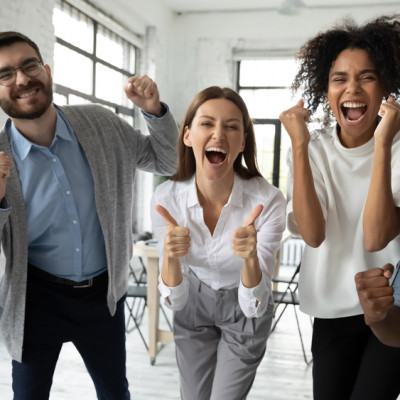 a group of people in a room with windows